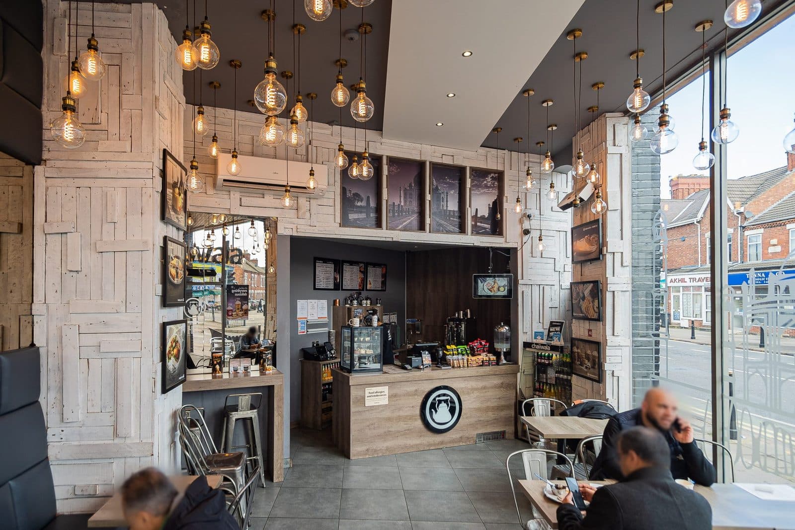 Chaiiwala interior with the counter, menu boards, pendant lighting and glazed frontage