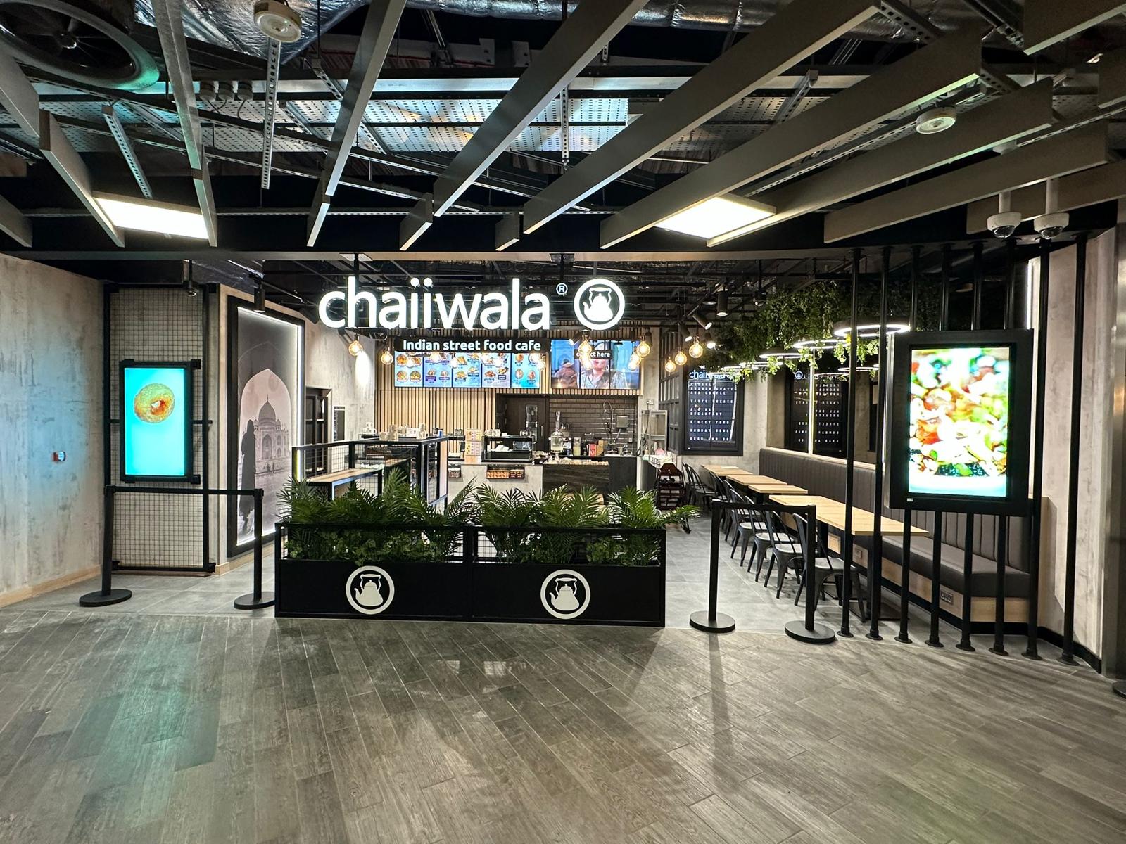 Chaiiwala café seating and servery under an exposed services ceiling