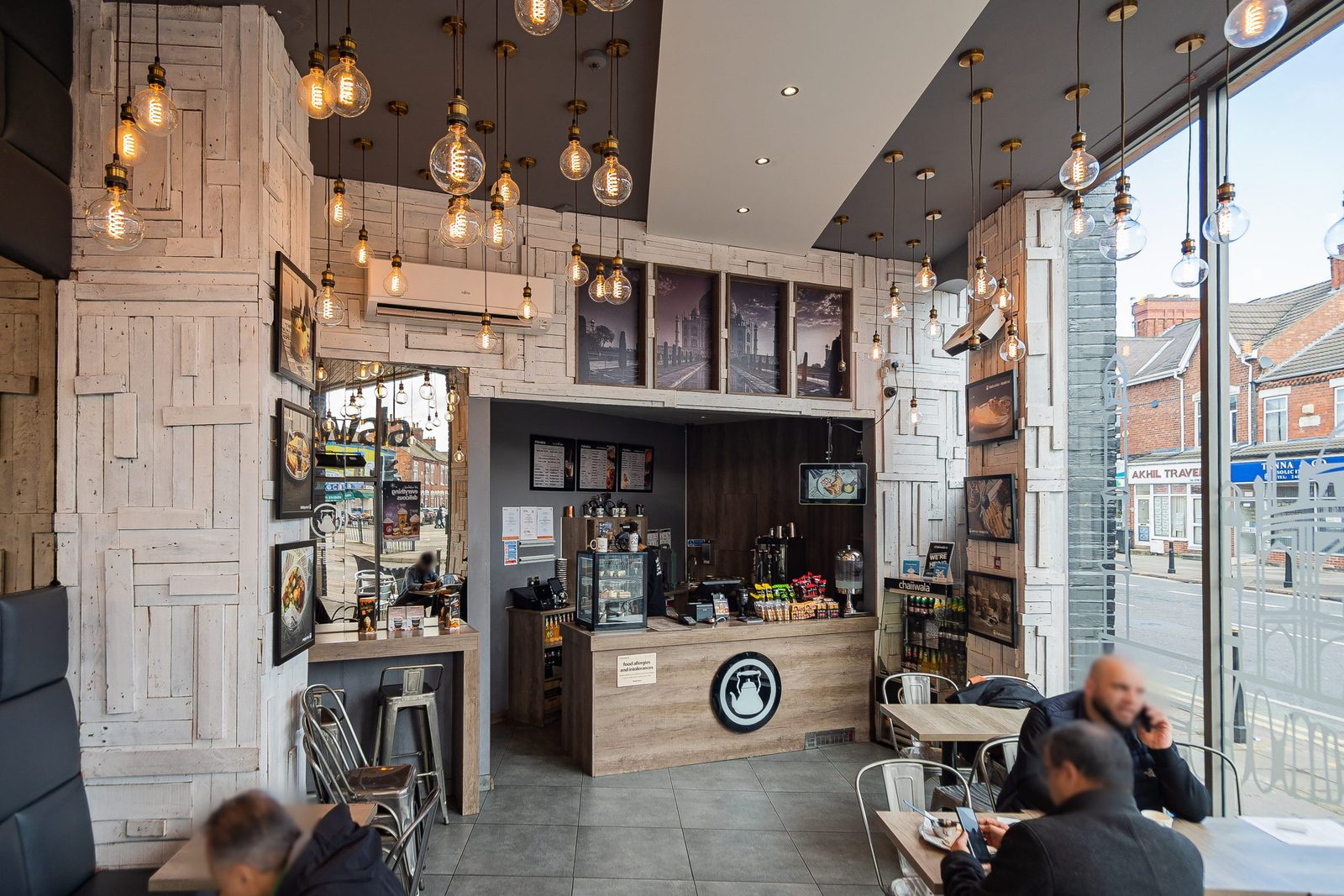 Chaiiwala interior with the counter, menu boards, pendant lighting and glazed frontage