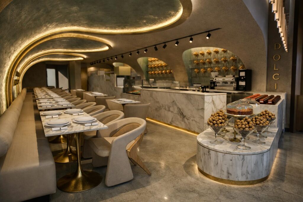 Vaulted dining room at Haute Dolci, with marble counters and concealed lighting
