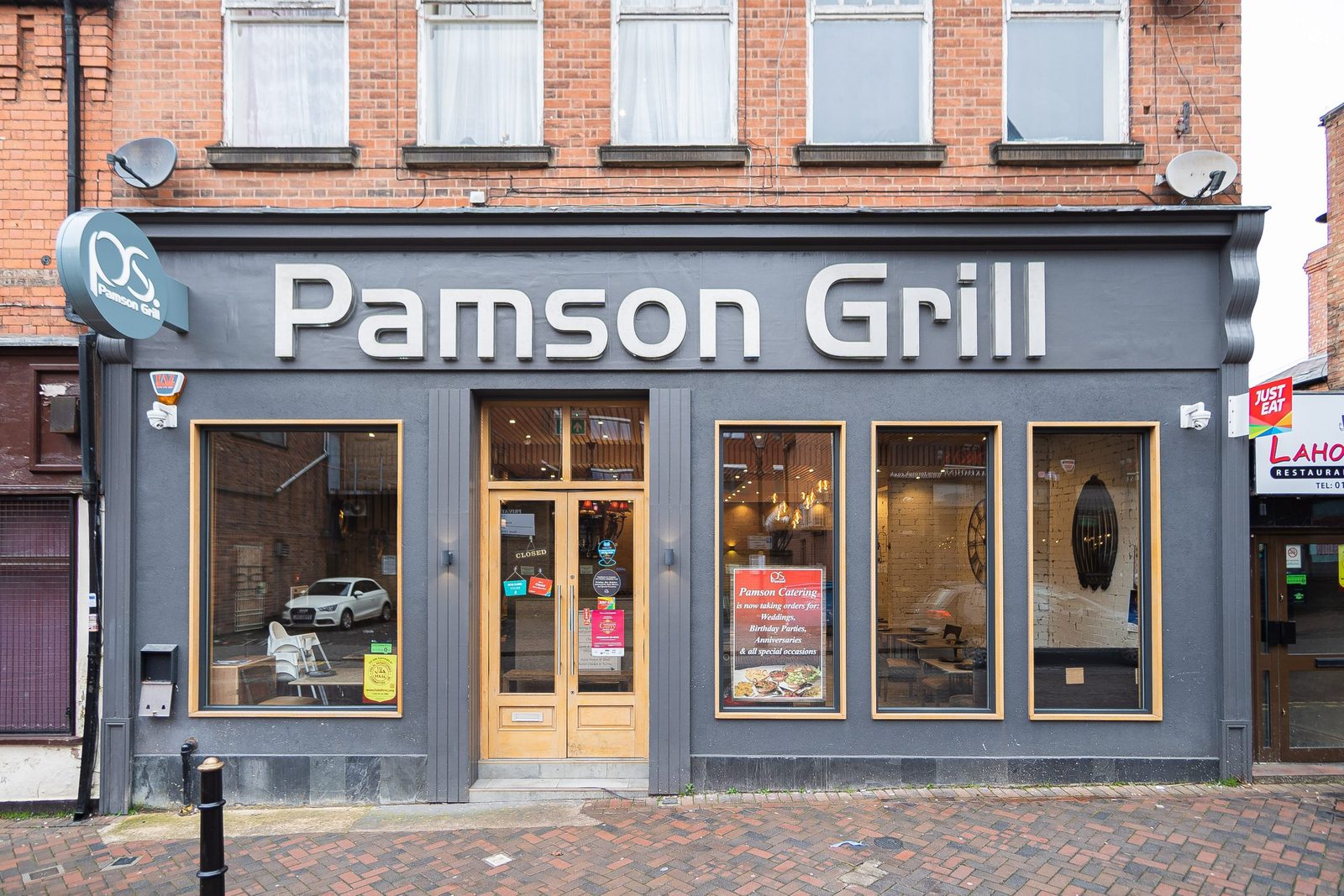 The Pamson Grill shopfront with new signage and timber-framed glazing